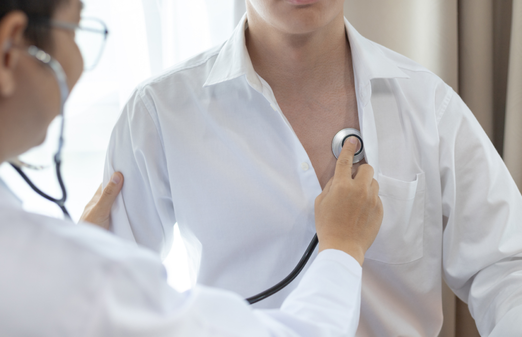 Cardiologist examining a patient with a stethoscope at Excellent Physiocare, providing the best cardio respiratory physiotherapy in JP Nagar.