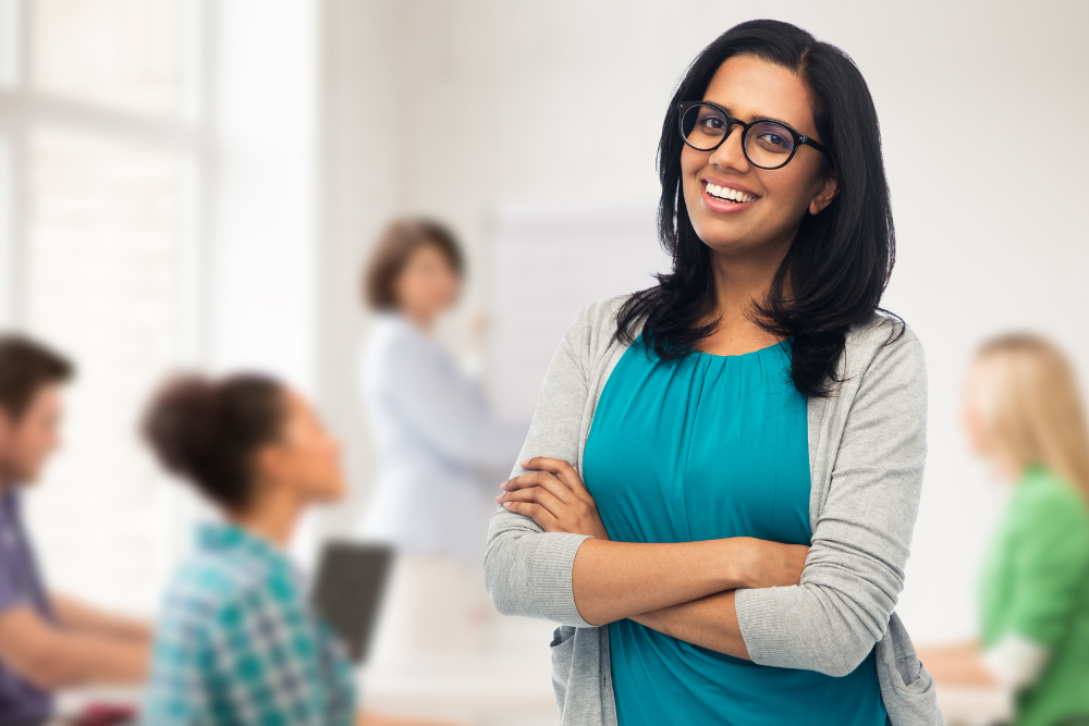 Confident female professional in a corporate setting, representing the excellence of the Best Neuro Physiotherapy in JP Nagar at Excellent Physiocare.