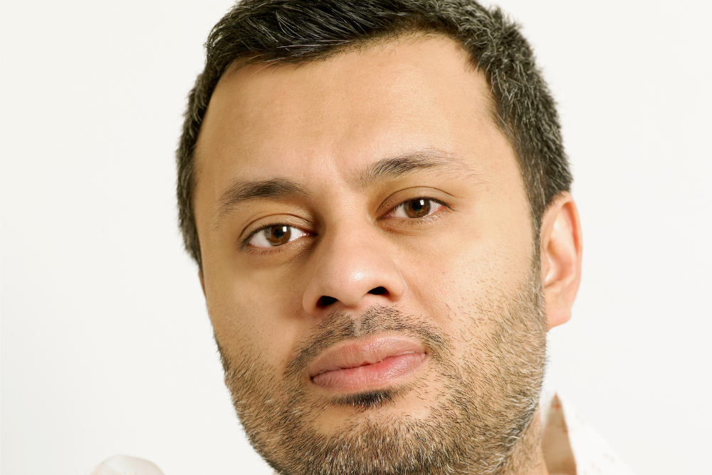 Smiling professional in a modern setting, showcasing the advanced care at the Best Neuro Physiotherapy in JP Nagar by Excellent Physiocare.