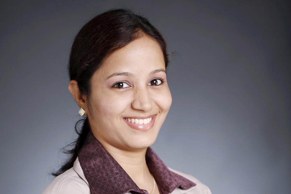 A professional seated at a desk, representing personalized care at the Best Antenatal and Postnatal Physiotherapy in JP Nagar.