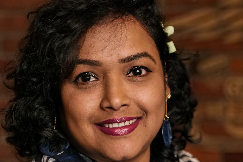 A joyful woman post-recovery from Best Sports Injury Physiotherapy in JP Nagar.